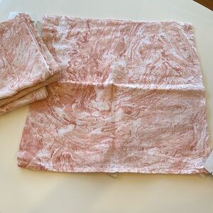 Anaya pink marbled linen pillow covers.